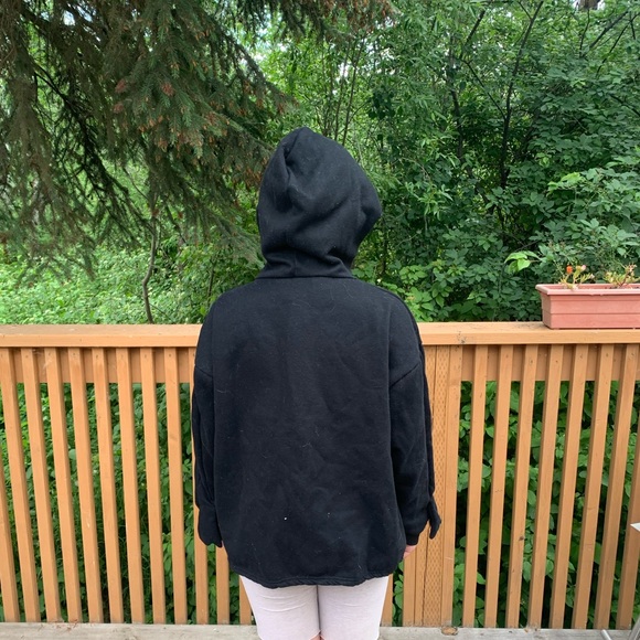 A frog hoodie that has the words “the frog kisses the princess” on it. - Picture 3 of 5